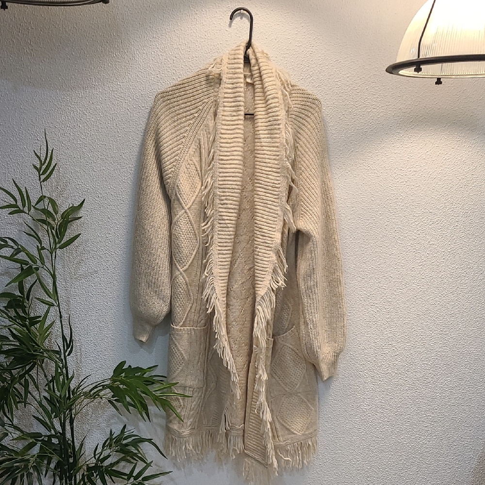 Cozy Cream Knit Sweater with Fringe